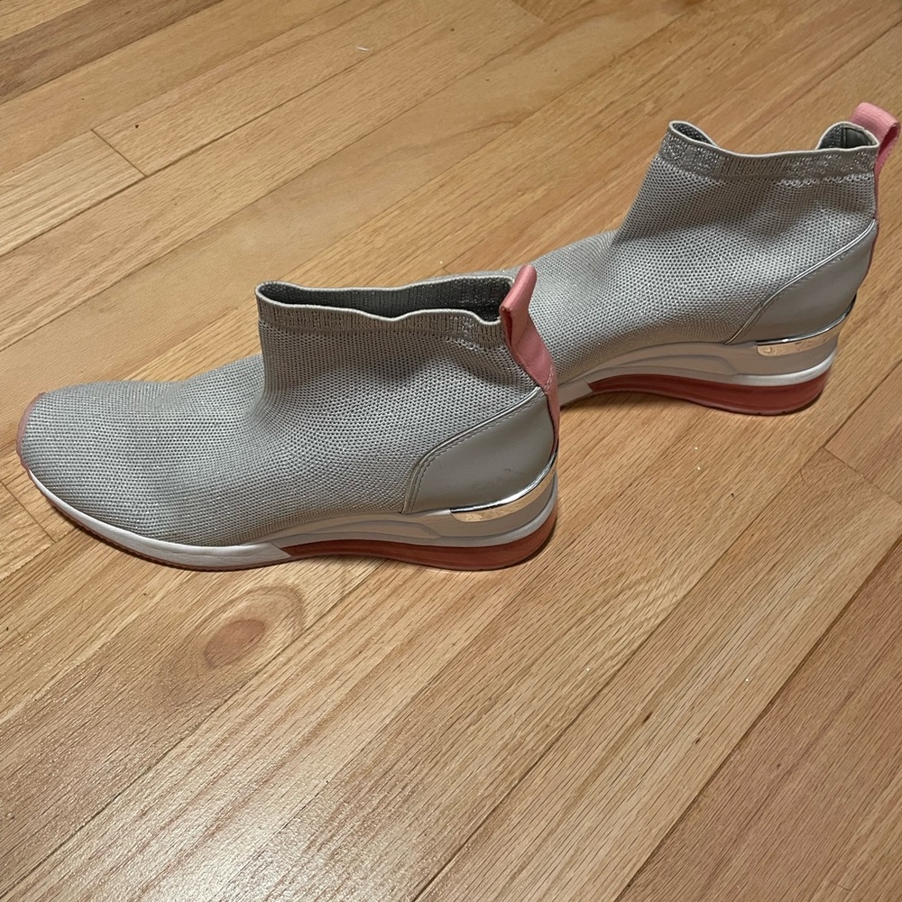 Michael Kors silver metallic with pink detail.